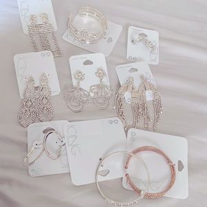 Icing 9 pack of jewelry including 3 bracelets and 6 earrings. (1 gold bracelet)